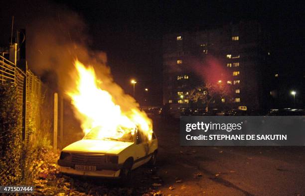 Car is burning, 05 November 2005 in the Cite de l'Europe neighborhood in Aulnay-sous-Bois, a northern surburb of Paris, on the tenth straight night...