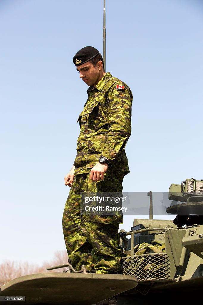 Canadian Soldier on Armoured Vehicle
