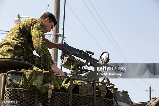 canadian soldier on armoured vehicle - canadian military uniform stock pictures, royalty-free photos & images