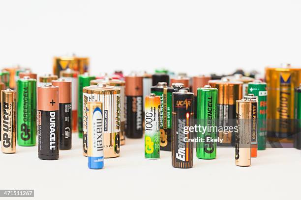 collection of different battery brands - alkaline stock pictures, royalty-free photos & images