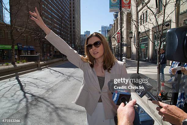 Danielle Robitaille, co-counsel for the defense of Jian Ghomeshi, unsuccessfully tries to hail a cab while media try to get a comment at the Yonge...
