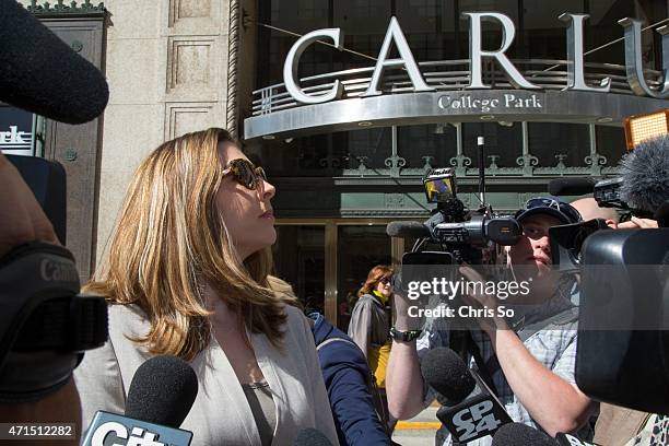 Danielle Robitaille, co-counsel for the defense of Jian Ghomeshi, unsuccessfully tries to hail a cab while media try to get a comment at the Yonge...