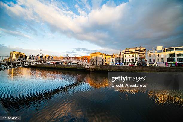 view of ha'penny bridge in dublin, ireland - dublin cityscape stock pictures, royalty-free photos & images