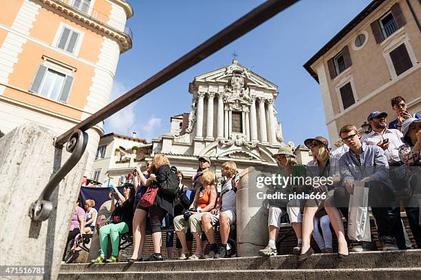 tourists resting at piazza di trevi, in rome - rome tourist stock pictures, royalty-free photos & images