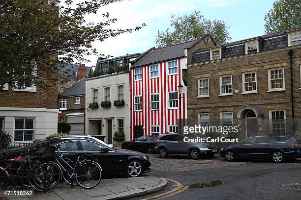 Townhouse that was painted in red and white stripes by its owner Zipporah Lisle-Mainwaring after a planning dispute with her neighbours is pictured...