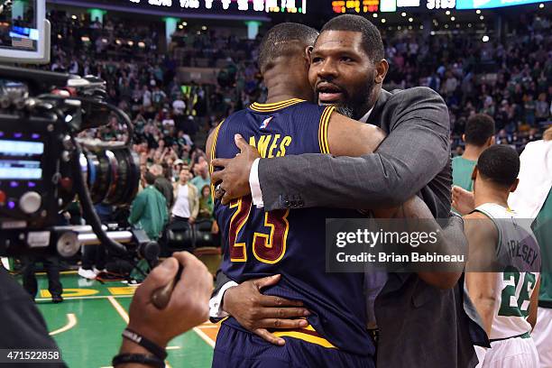 LeBron James of the Cleveland Cavaliers and Walter McCarty of the Boston Celtics hug after Game Four of the Eastern Conference Quarterfinals during...