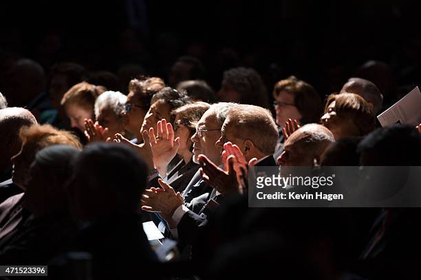 People applaud as democratic presidential hopeful and former Secretary of State Hillary Clinton speaks during the David N. Dinkins Leadership and...