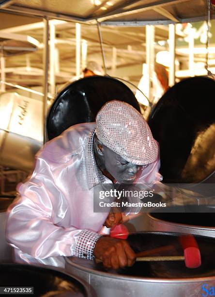 man playing a steel drum. - steel drum stock pictures, royalty-free photos & images