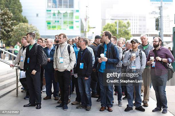 Attendees stand outside Moscone Center during the 2015 Microsoft Build Conference on April 29, 2015 in San Francisco, California. Thousands are...