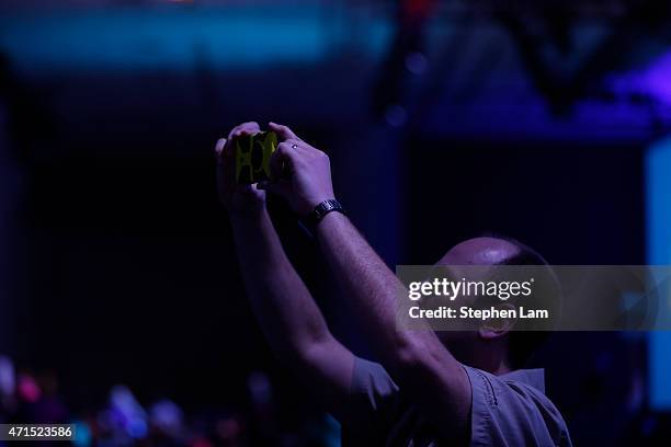 An attendee takes a photograph with a Microsoft phone during the 2015 Microsoft Build Conference on April 29, 2015 at Moscone Center in San...