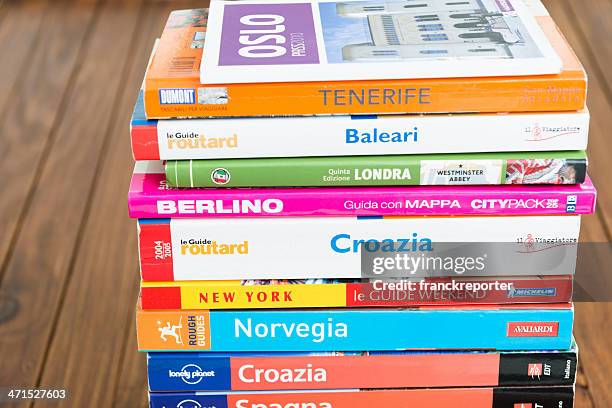 travel guide books on the wood table - indian tour guide stock pictures, royalty-free photos & images