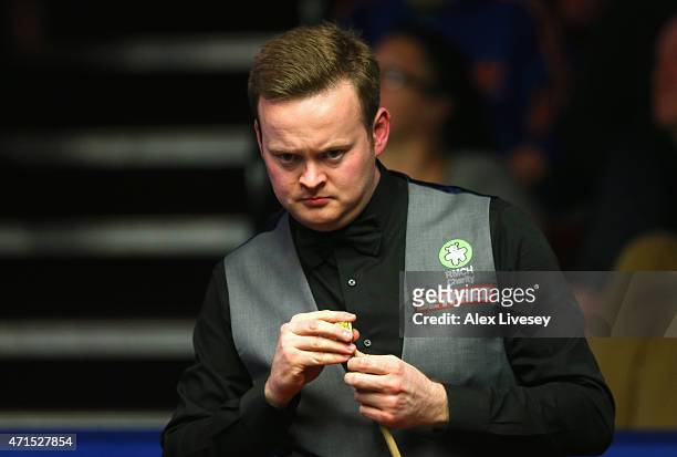 Shaun Murphy lines up a shot during his victory over Anthony McGill on day twelve of the 2015 Betfred World Snooker Championship at Crucible Theatre...