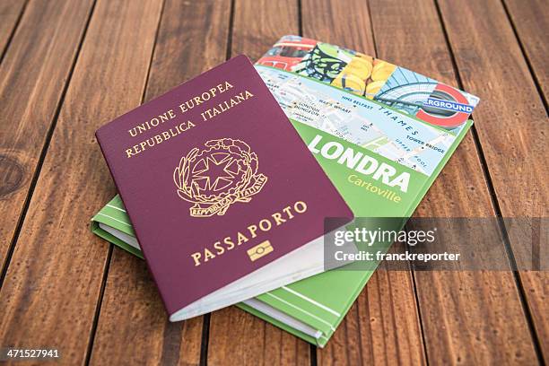 london travel guide books on the wood table with passport - indian tour guide stock pictures, royalty-free photos & images