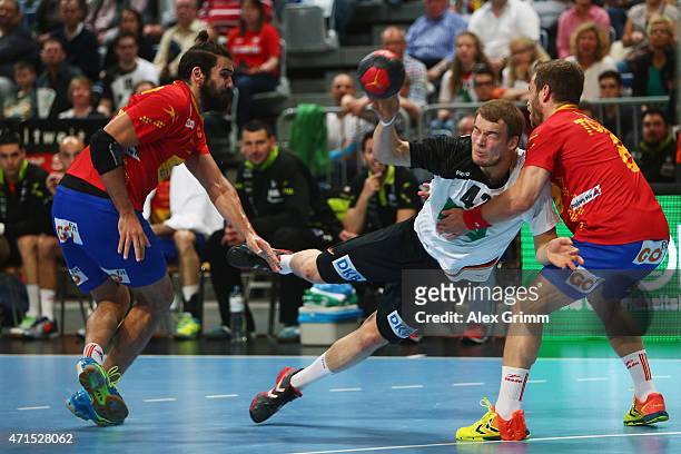 Paul Drux of Germany is challenged by Jorge Maqueda Pena 8l9 and Victor Tomas Gonzalez of Spain during the European Handball Championship 2016...