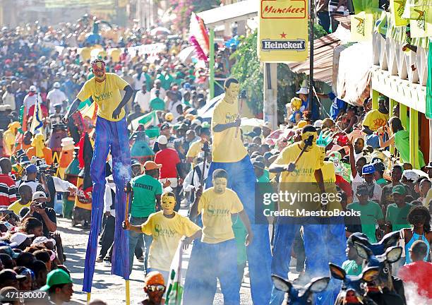 stilt walker parade - caribbean culture stock pictures, royalty-free photos & images