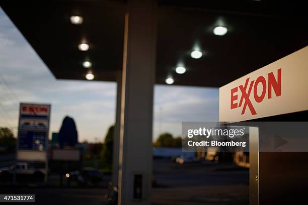 Exxon Mobil Corp. Signage is displayed on a fuel pump at a gas station in Richmond, Kentucky, U.S., on Wednesday, April 29, 2015. Exxon Mobil Corp....