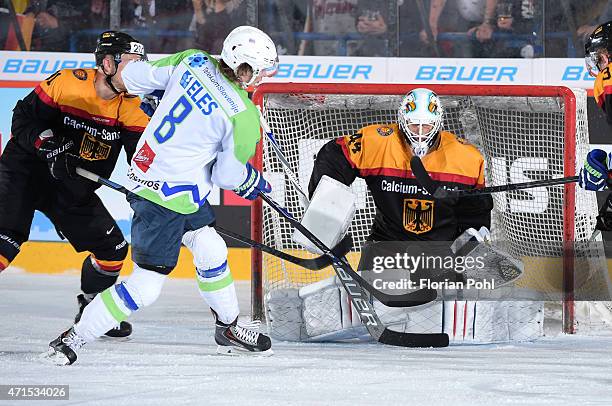 Ziga Jeglic of Team Slovenia and Dennis Endras of Team Germany during the game between Germany and Slovenia on april 29, 2015 in Berlin, Germany.