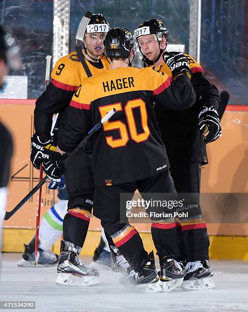 Thomas Rieder, Patrick Hager and Michael Wolf of Team Germany during the game between Germany and Slovenia on april 29, 2015 in Berlin, Germany.
