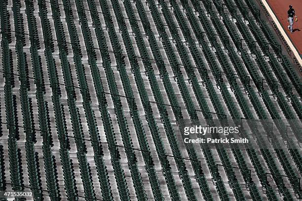 Alexei Ramirez of the Chicago White Sox sits in the walks by the stands before playing the Baltimore Orioles at an empty Oriole Park at Camden Yards...