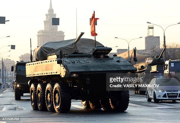 Russian new armoured personnel carrier VPK-7829 BUMERANG moves down Moscow for the Victory Day military parade night training on April 29, 2015....