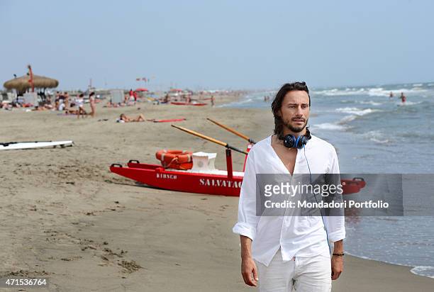 "The French dj Bob Sinclar, pseudonym of Christophe Le Friant, walking on the seashore during a photo shoot on July 1st on the beach of Fregene, Rome...