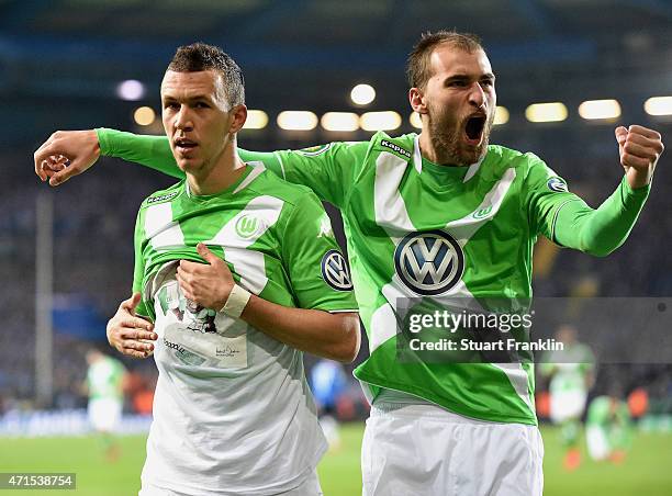 Ivan Perisic of Wolfsburg celebrates with his team-mate Bas Dost of Wolfsburg after scoring his team's third goal during the DFB Cup Semi Final match...