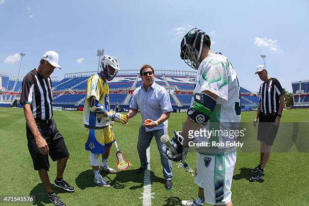 Jake Steinfeld, the founder of Major League Lacrosse, performs a ceremonial face-off with Chris Mattes of the Florida Launch and Stephen Robarge of...