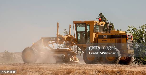 caterpillar road grader in action - caterpillar inc stock pictures, royalty-free photos & images