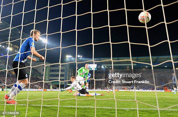 Maximilian Arnold of Wolfsburg scores his team's fourth goal during the DFB Cup Semi Final match between Arminia Bielefeld and VfL Wolfsburg at...