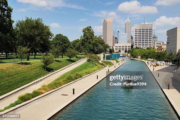 family enjoys pedal boat on canal in downtown indianapolis - indianapolis canal stock pictures, royalty-free photos & images