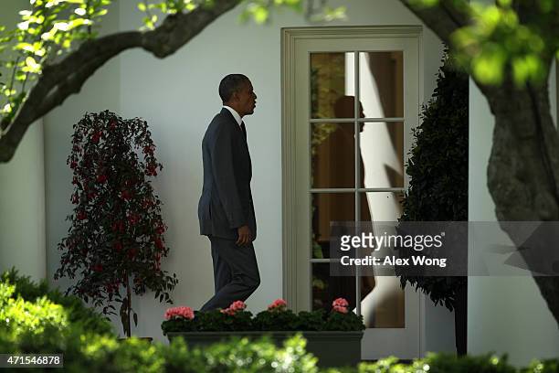 President Barack Obama walks towards to the Oval Office after he has returned to the White House April 29, 2015 in Washington, DC. Obama has placed a...