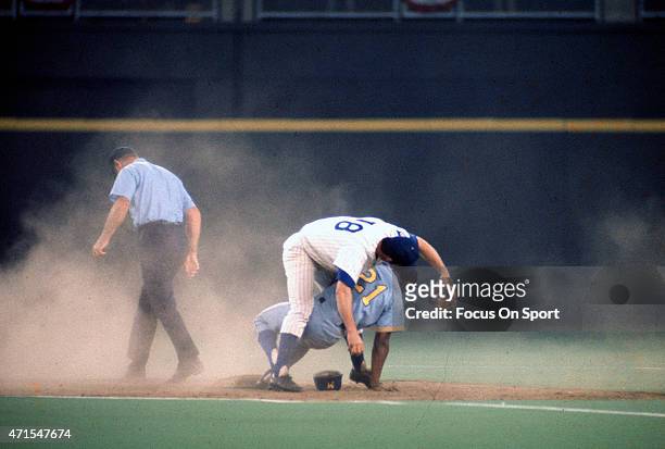 Tommy Harper of the Milwaukee Brewers and the American League AllStars is tagged out after colliding at second base with Glenn Beckert of the Chicago...