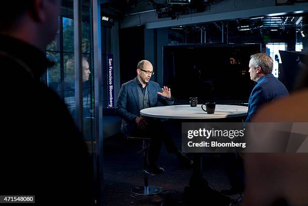 Richard "Dick" Costolo, chief executive officer of Twitter Inc., left, speaks during a Bloomberg Television interview in San Francisco, California,...