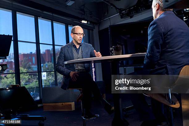 Richard "Dick" Costolo, chief executive officer of Twitter Inc., left, speaks during a Bloomberg Television interview in San Francisco, California,...