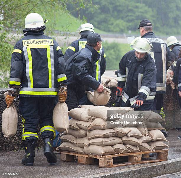 floodwater helper in germany - firefighters in the shower stock pictures, royalty-free photos & images