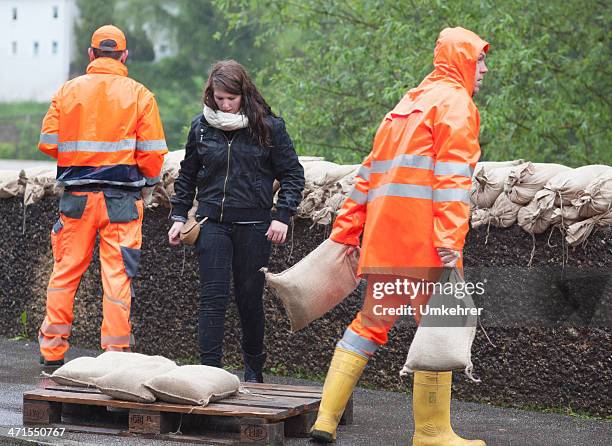 floodwater helper - sandbag stock pictures, royalty-free photos & images