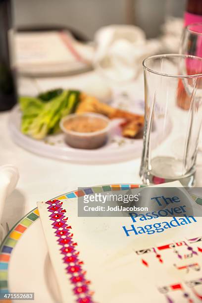 traditional passover seder table with haggadah - matzah stock pictures, royalty-free photos & images