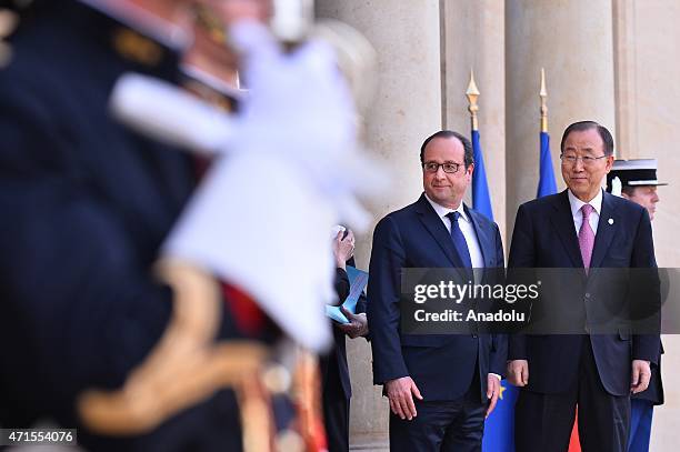 French President Francois Hollande welcomes UNESCO Director General Irina Bokova and United Nations Secretary-General Ban Ki-Moon prior to a meeting...