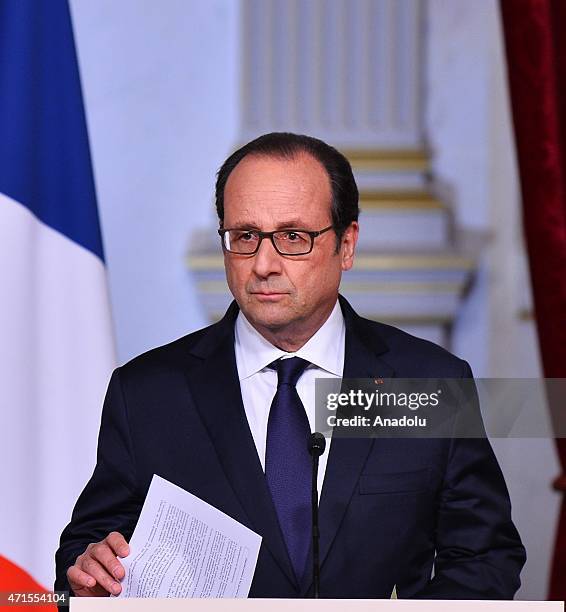 French President Francois Hollande holds a joint press conference with United Nations Secretary-General Ban Ki-Moon at the Elysee Palace on April 29,...