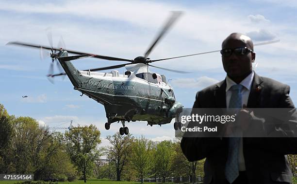 President Barack Obama arrives at Walter Reed National Military Medical Center aboard Marine One April 29, 2015 in Bethesda, Maryland. The...