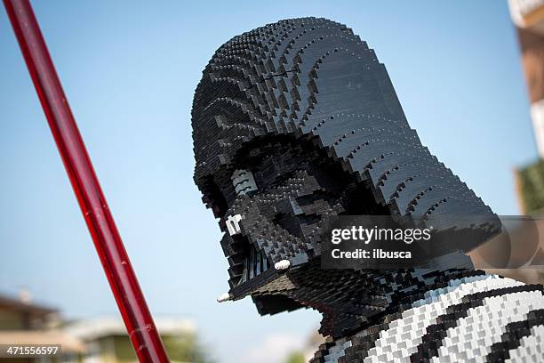 darth vader made of lego bricks outside toy store - light saber stock pictures, royalty-free photos & images
