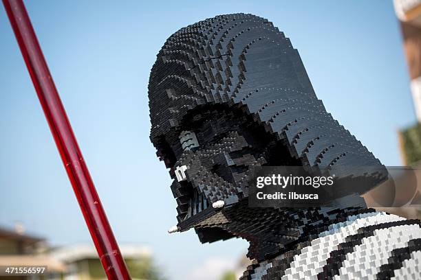 darth vader made of lego bricks outside toy store - laser sword stock pictures, royalty-free photos & images