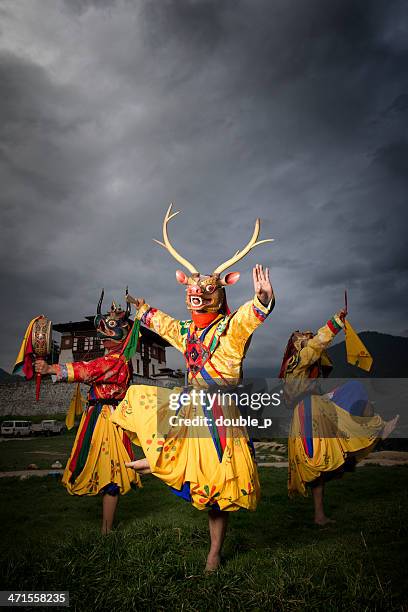 traditional bhutan dancers - bhutan monks stock pictures, royalty-free photos & images