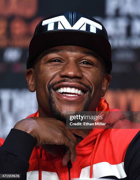 Welterweight champion Floyd Mayweather Jr. Laughs during a news conference at the KA Theatre at MGM Grand Hotel & Casino on April 29, 2015 in Las...