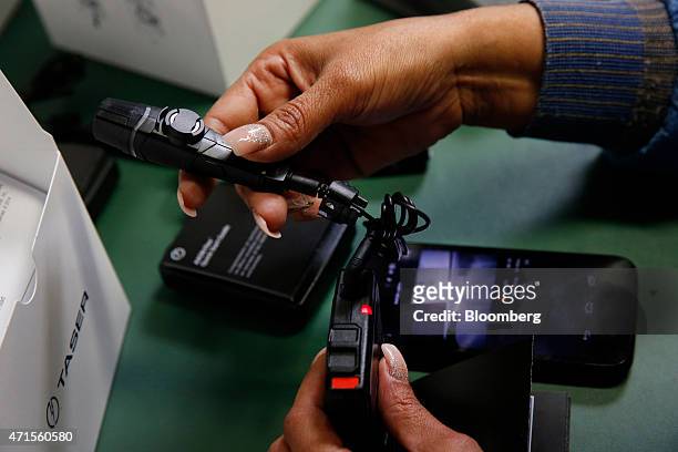 An employee tests and packages the AXON police body cameras at the Taser International Inc. Manufacturing facility in Scottsdale, Arizona, U.S., on...