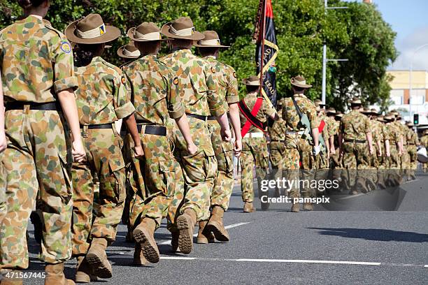 soldiers marching away on anzac day - anzac day stock pictures, royalty-free photos & images