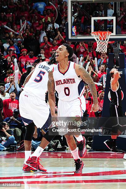 Jeff Teague of the Atlanta Hawks celebrates with his teammates in Game Five of the Eastern Conference Quarterfinals against the Brooklyn Nets during...