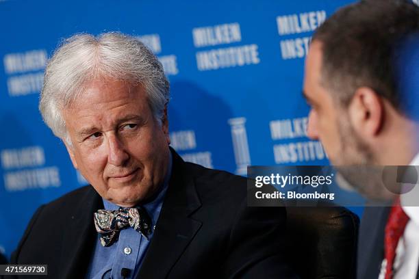 Matthew Winkler, editor-in-chief emeritus at Bloomberg News, left, listens during the annual Milken Institute Global Conference in Beverly Hills,...