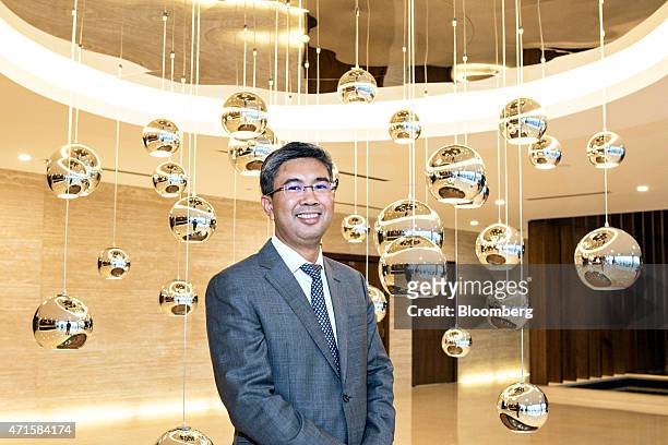 Tengku Zafrul Aziz, chief executive officer of CIMB Group Holdings Bhd., poses for a portrait before an interview in Kuala Lumpur, Malaysia, on...