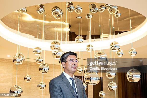 Tengku Zafrul Aziz, chief executive officer of CIMB Group Holdings Bhd., poses for a portrait before an interview in Kuala Lumpur, Malaysia, on...